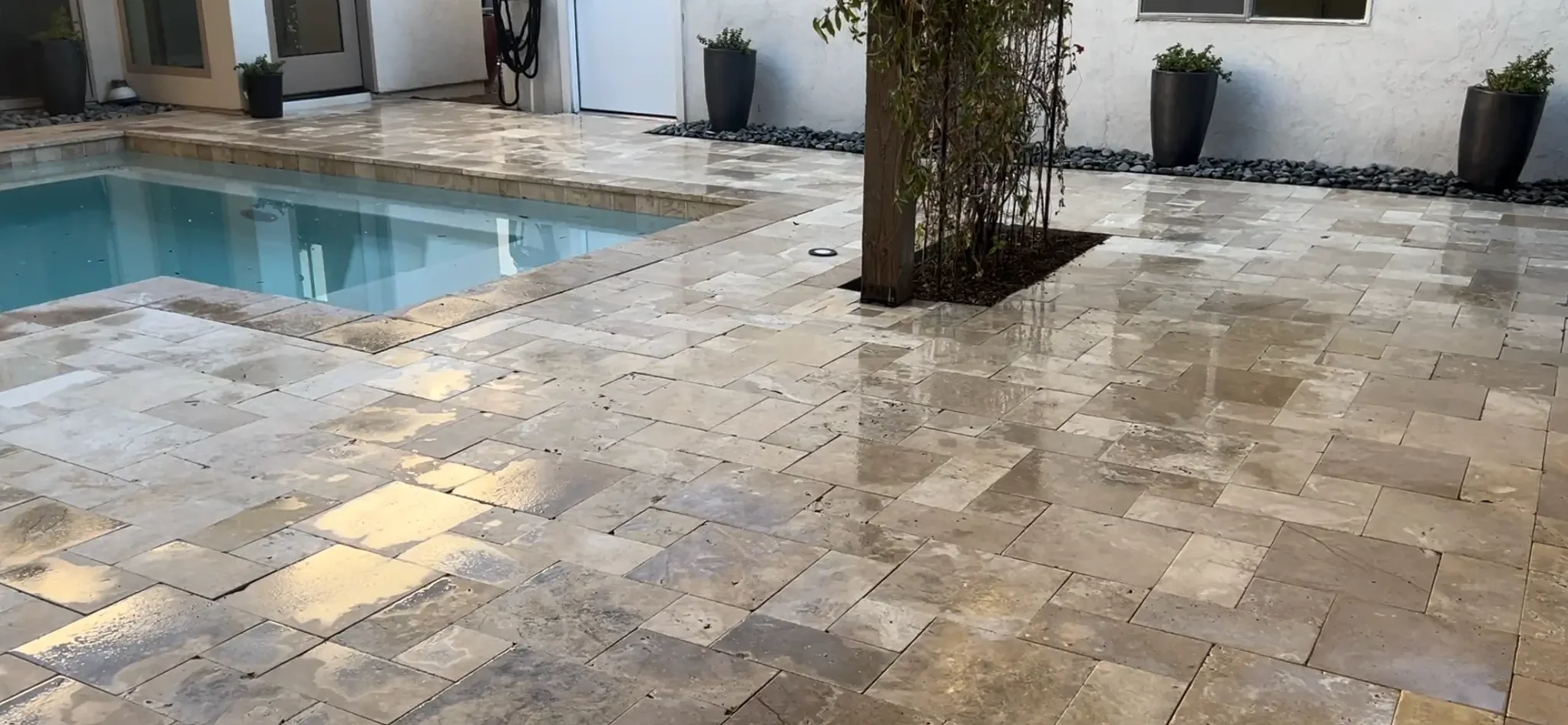 TJ Landscape Travertine tile and pool coping installation